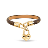Bracelet with heart-shaped gold lock charm on a transparent background