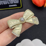 18K CC Bow Tie Gold Brooch
