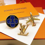 Louis Vuitton-themed cufflinks on a Louis Vuitton packaging with 'Monogram World Tour' text.