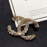 18K CC Pearl Twist Gold Brooch